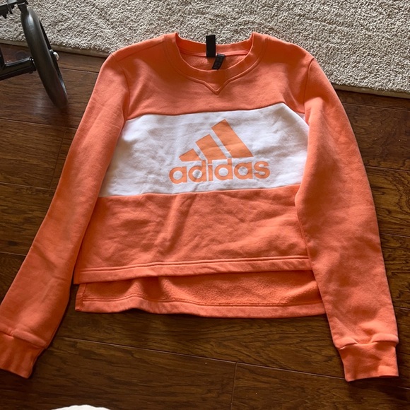 peach colored sweatshirt